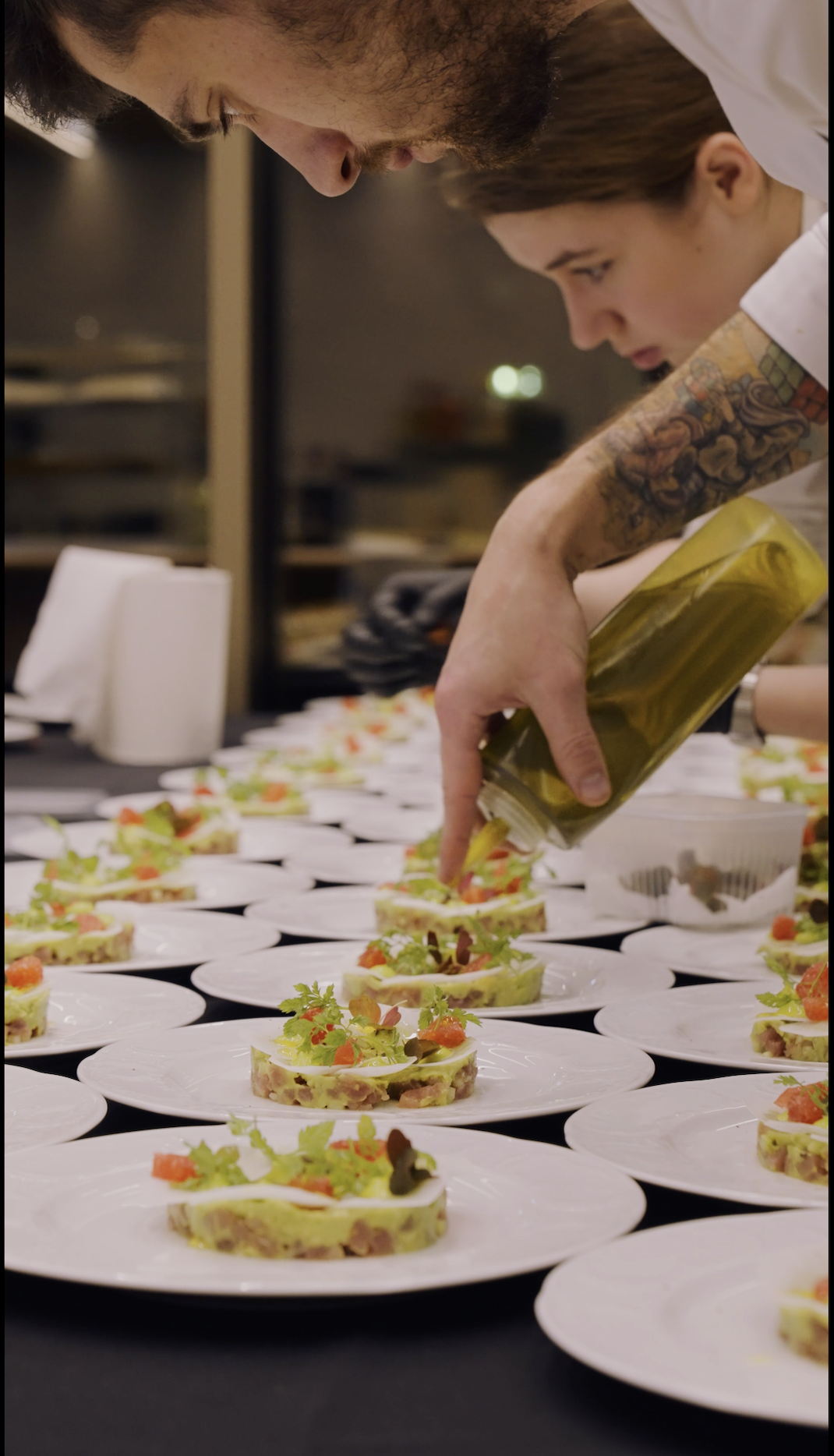 Chefs plating starters for a gala dinner